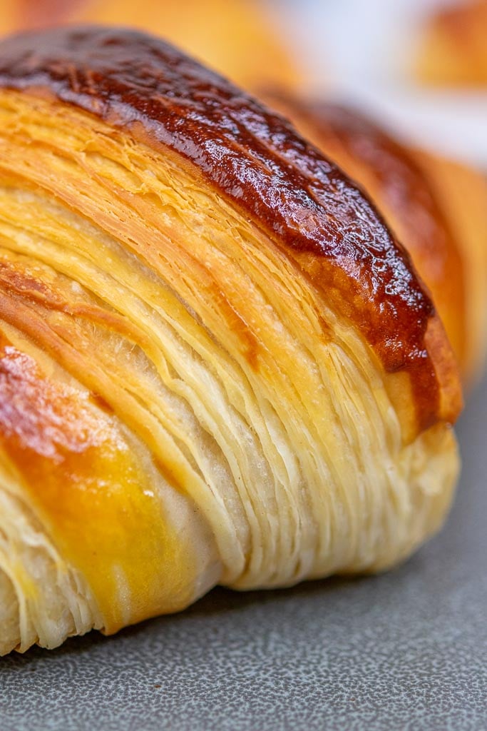 Close up of visible flaky layers of a sourdough croissant