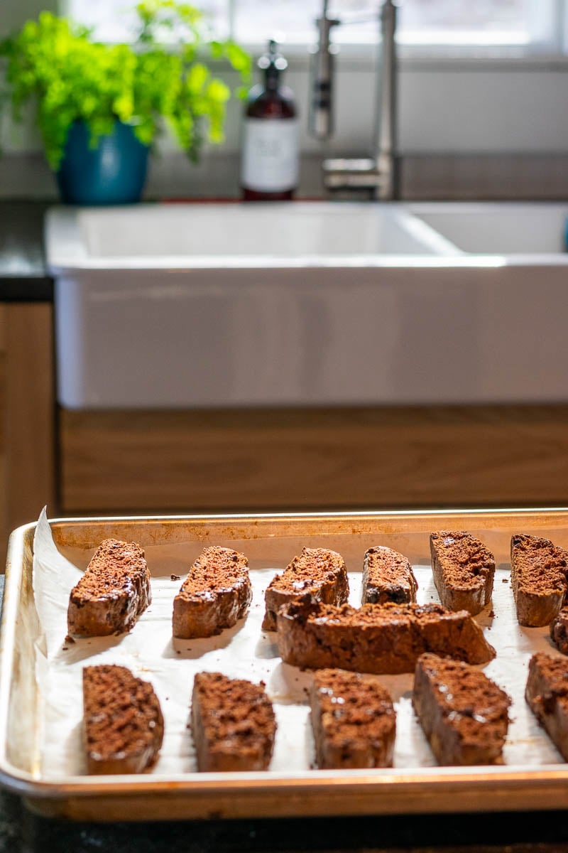 Baked chocolate sourdough biscotti on kitchen counter