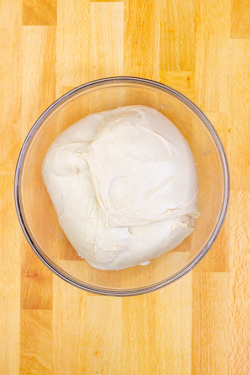 Beignet dough in bowl at the start of proofing
