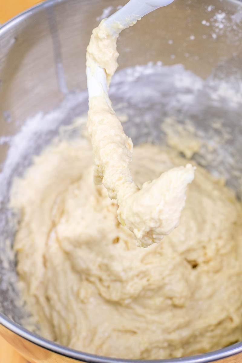 Beignet dough in mixing bowl at the start of mixing. It is sticky and wet.