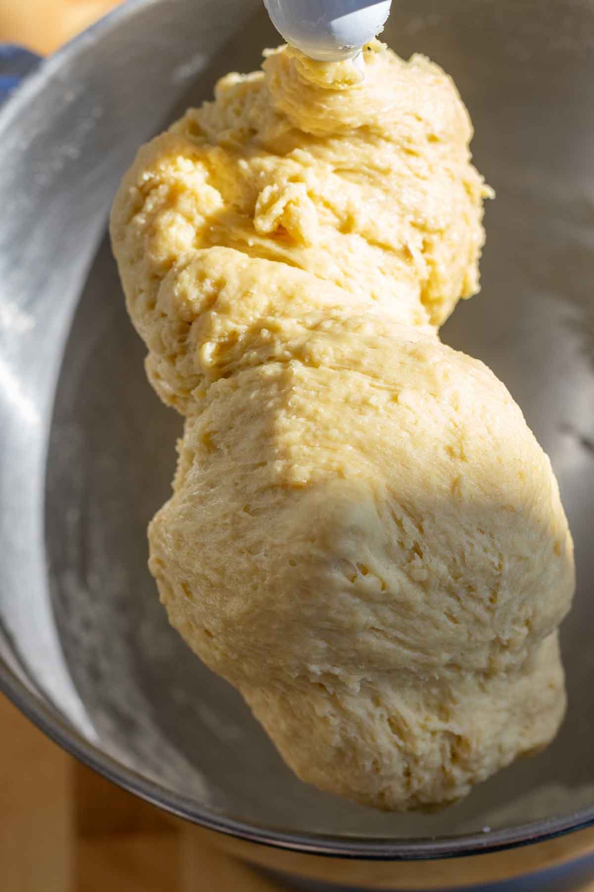 Sourdough babka dough in bread hook in stand mixer before adding in butter