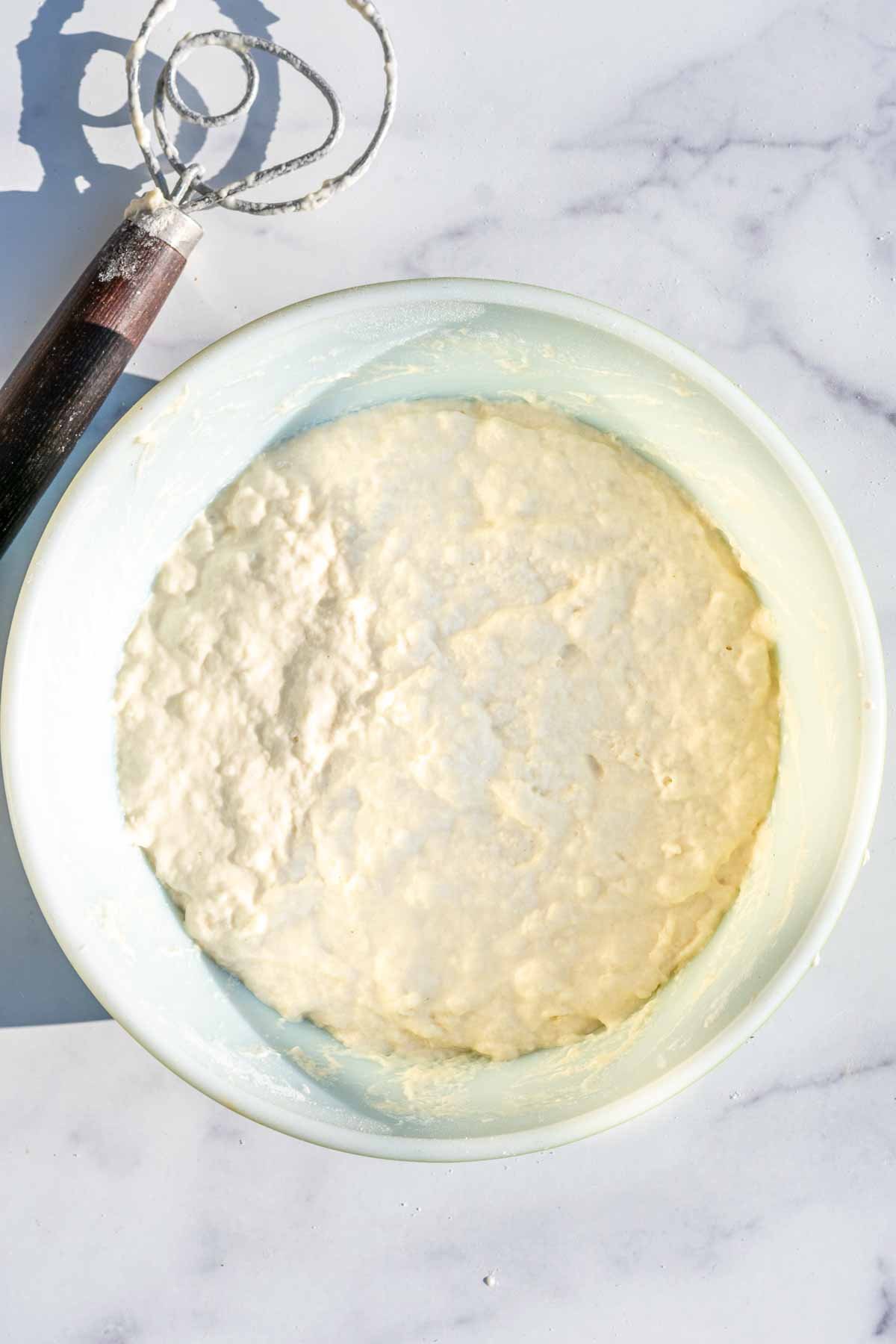 Pan de cristal dough in mixing bowl at the start of bulk fermentation