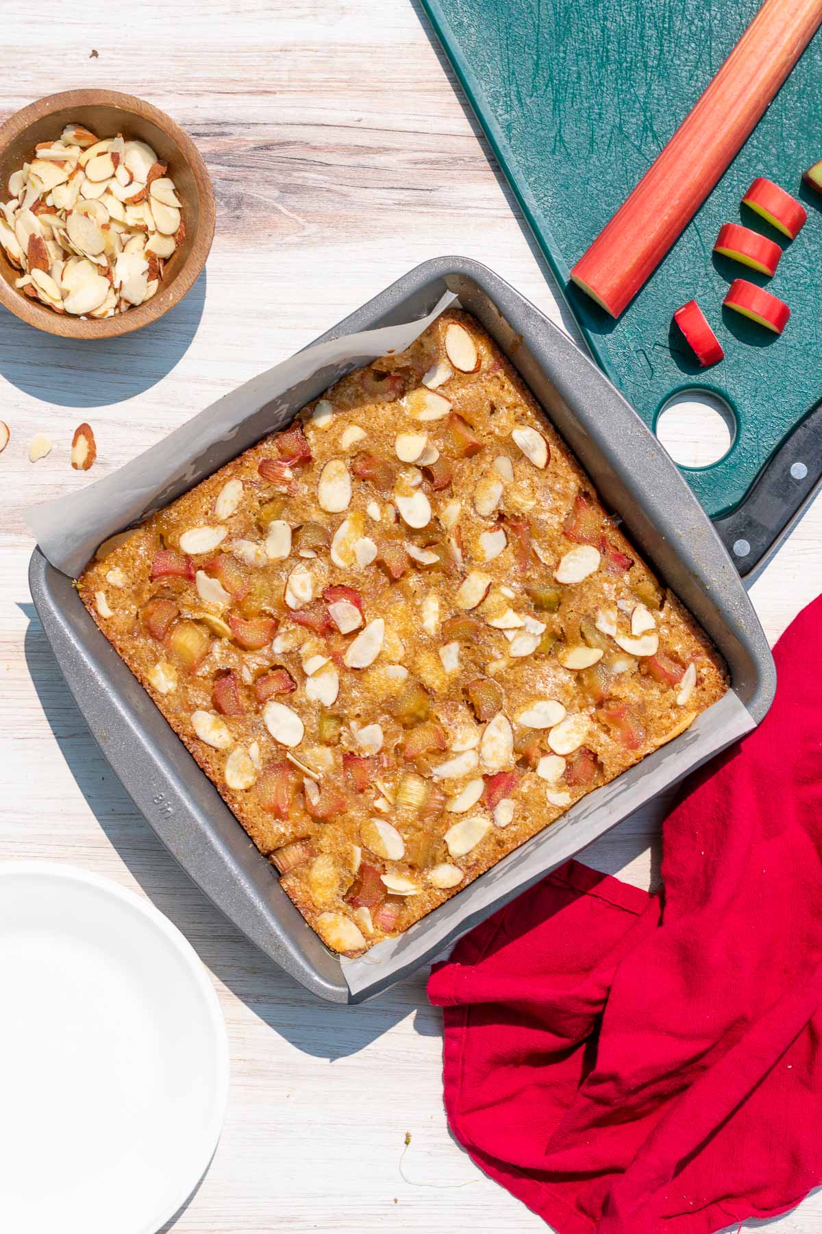 Pan of baked sourdough blondies with rhubarb and almonds