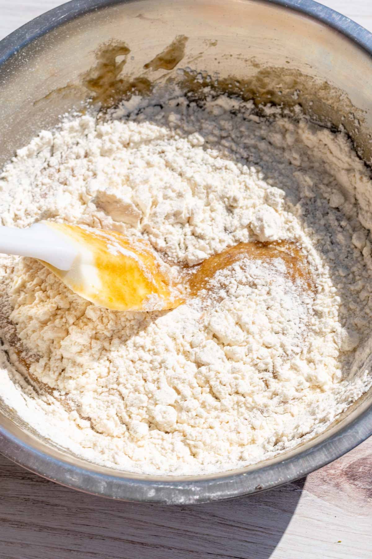 Flour and salt added to bowl of wet ingredients