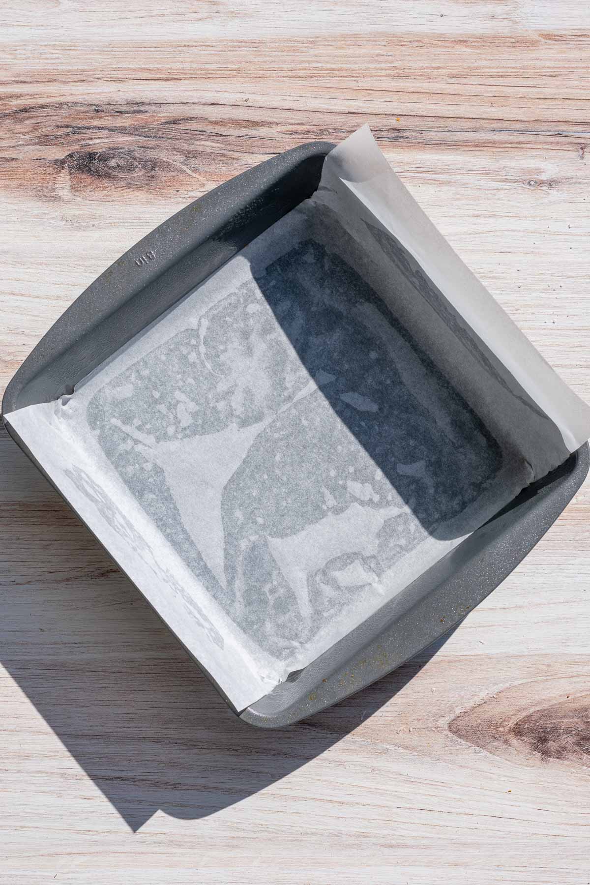 Prepared 8 inch square pan with parchment paper