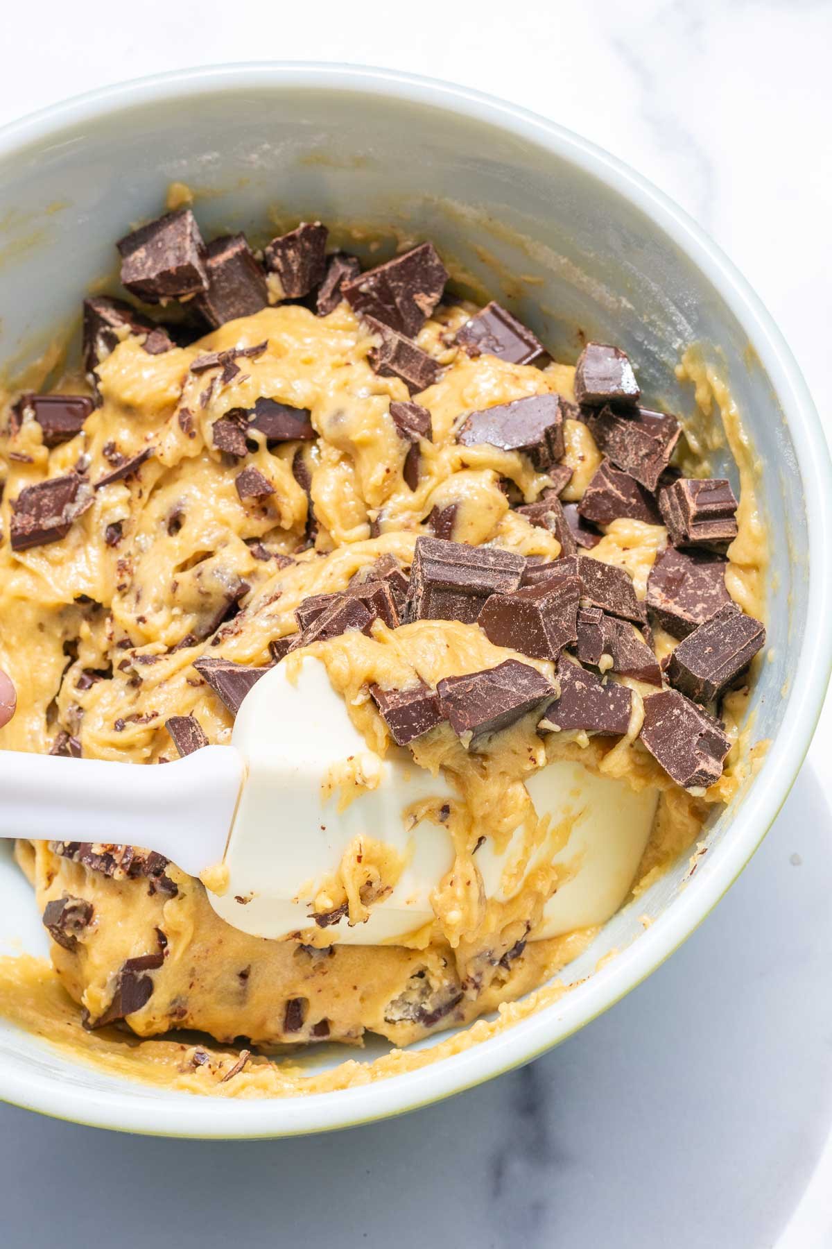 Spatula folding in chocolate chunks