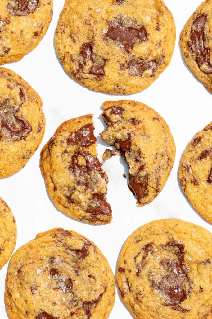 Gooey Sourdough Discard Chocolate Chip Cookies on a marble surface