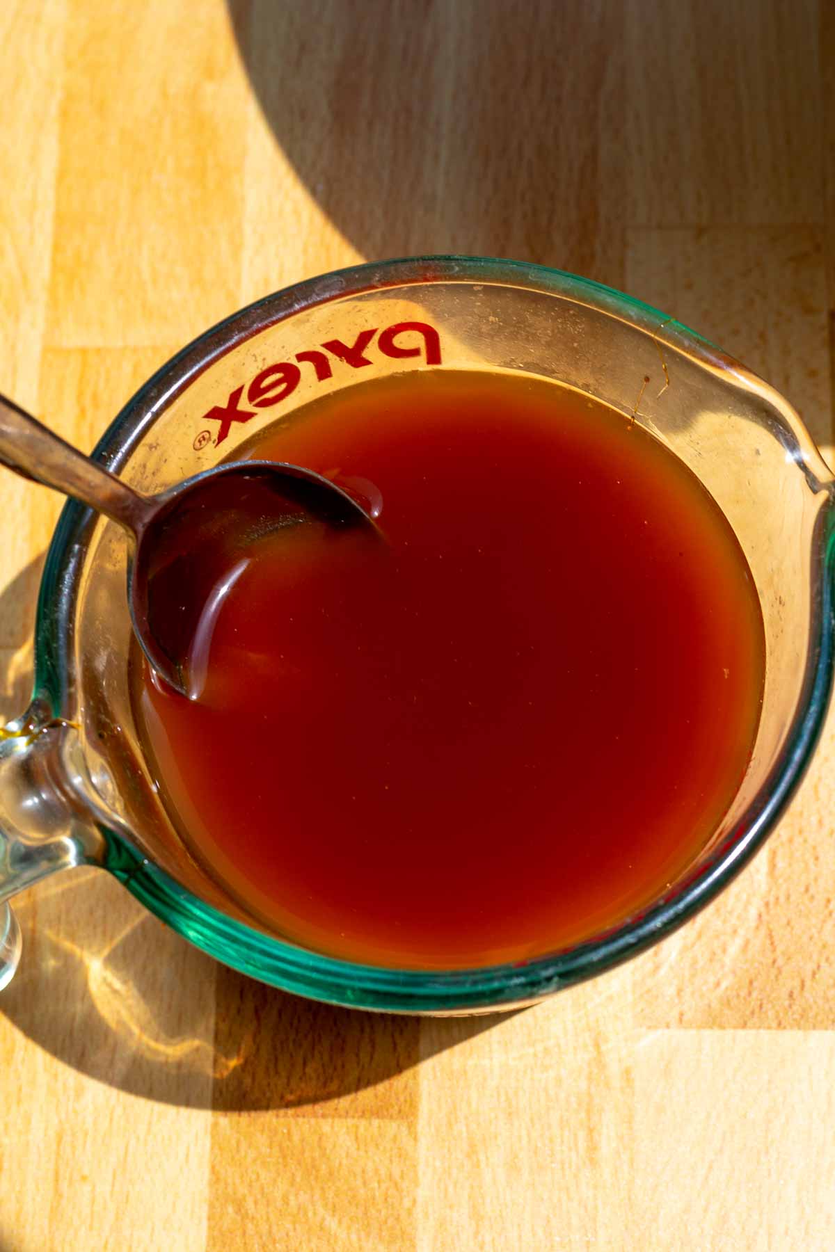 Mixed water and barley malt syrup in container