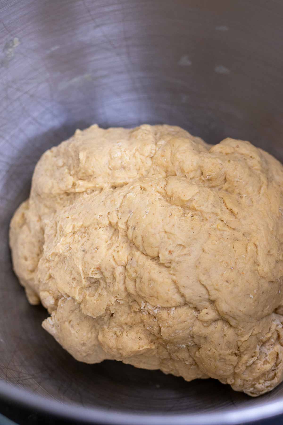 Sourdough bagel dough mixed in bowl