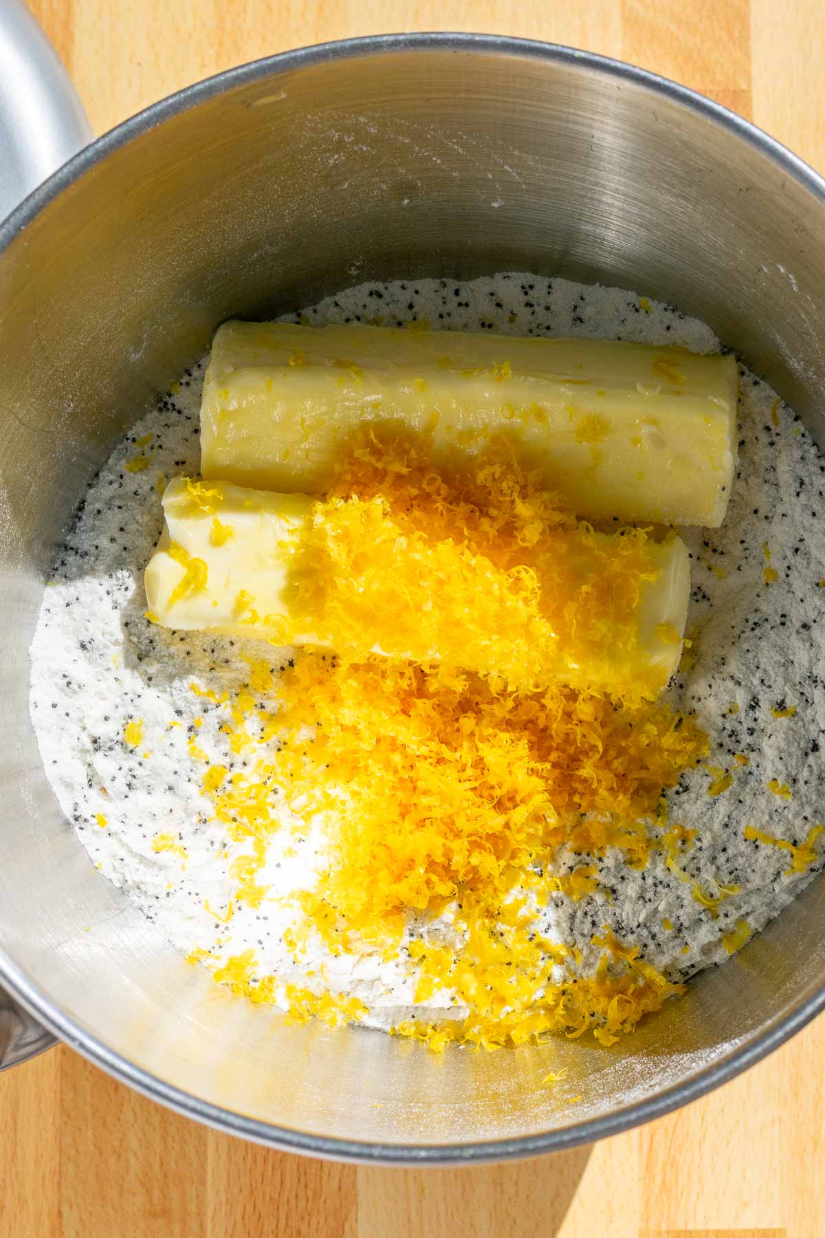 Two sticks of butter and lemon zest added to bowl of stand mixer