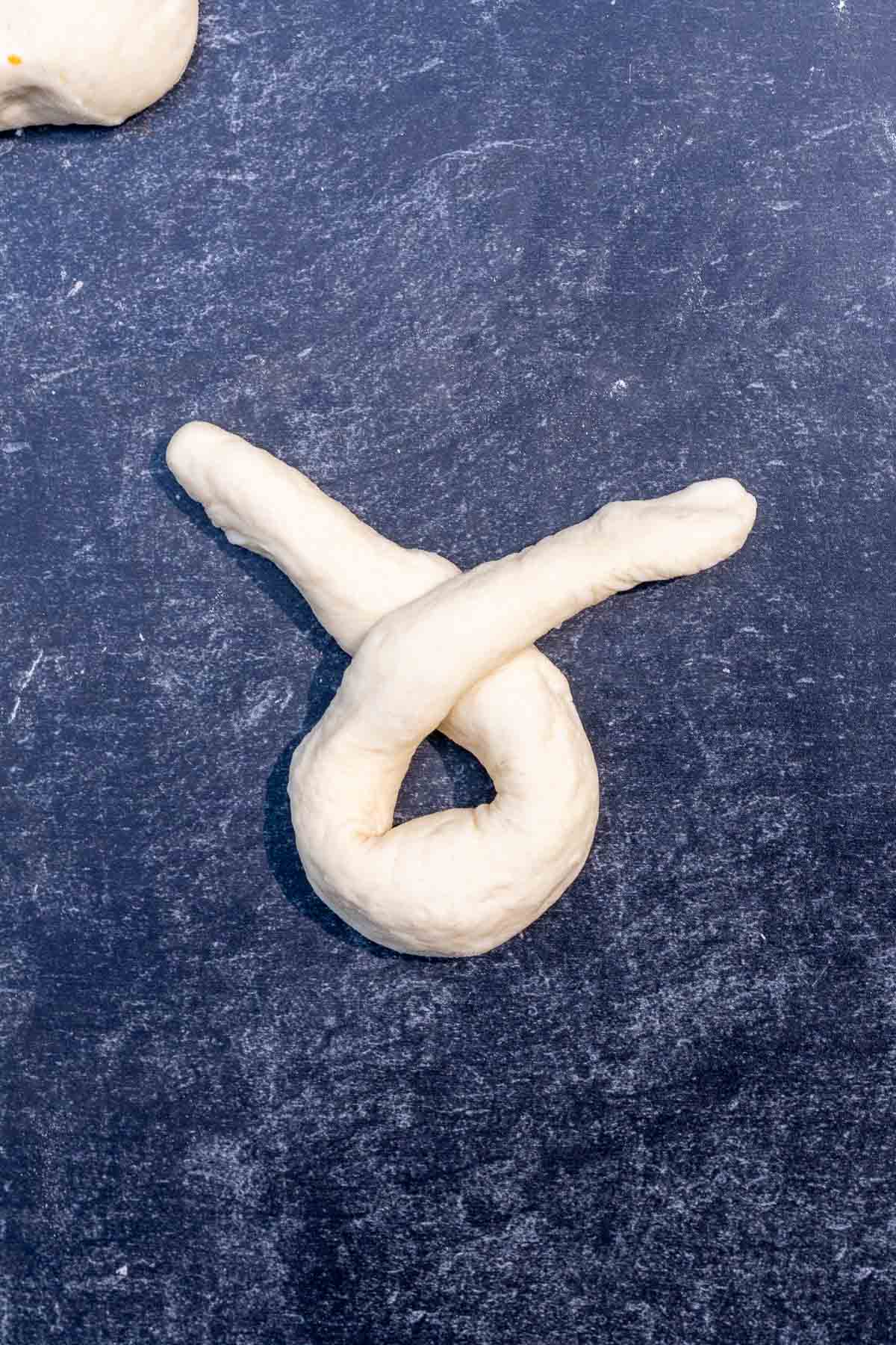 The ends crossed over for a sourdough garlic knot