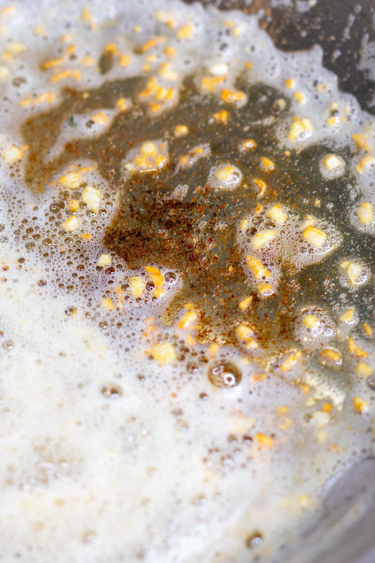 Roasted garlic in pan with butter