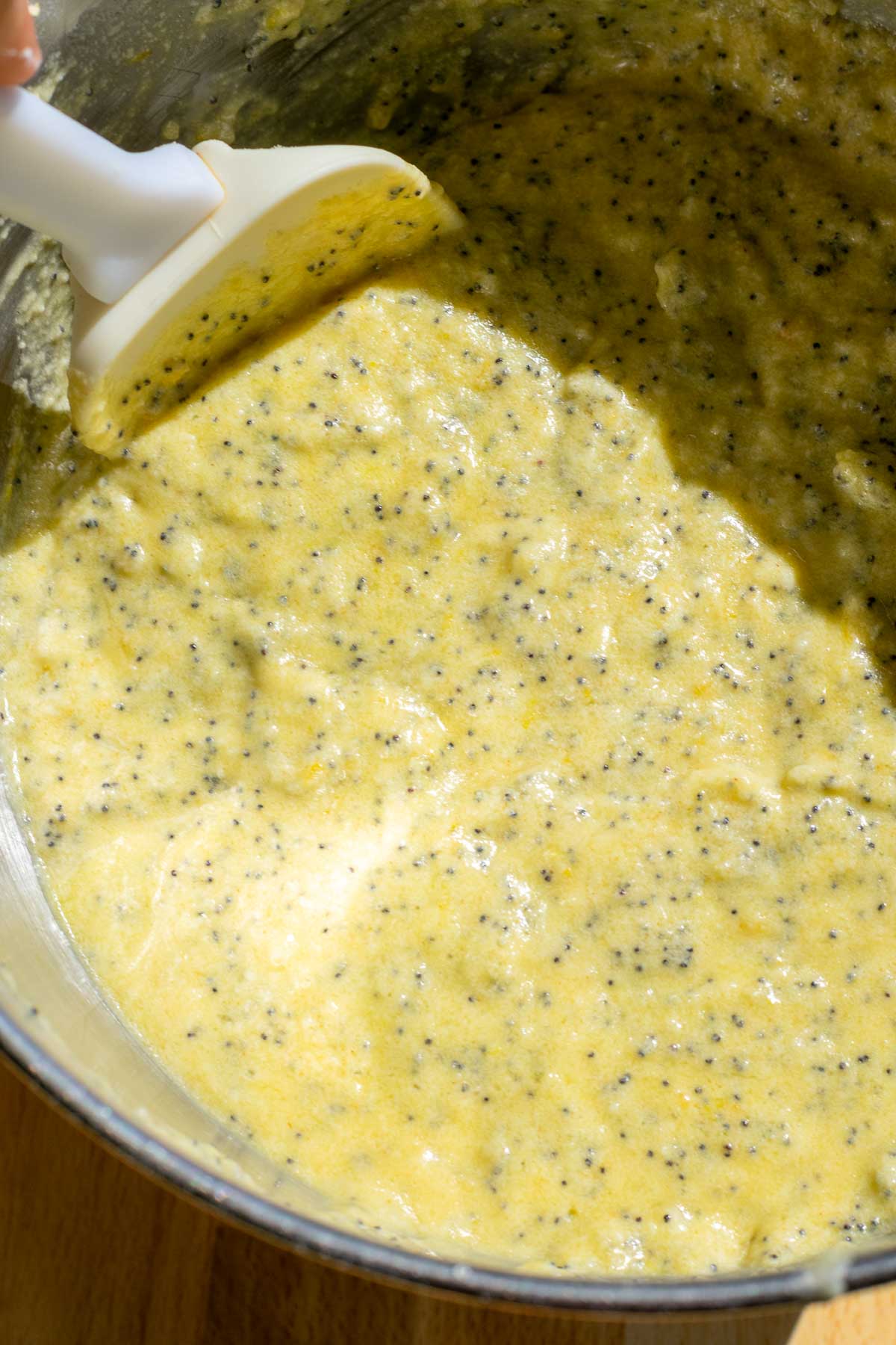 Bowl of sourdough lemon poppy seed bundt cake batter