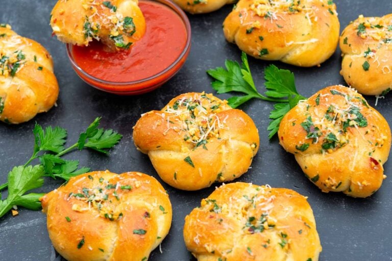 Sourdough Garlic Knots with marinara sauce and parsley