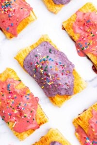 Sourdough Pop Tarts with blueberry and strawberry jam icings and rainbow sprinkles.