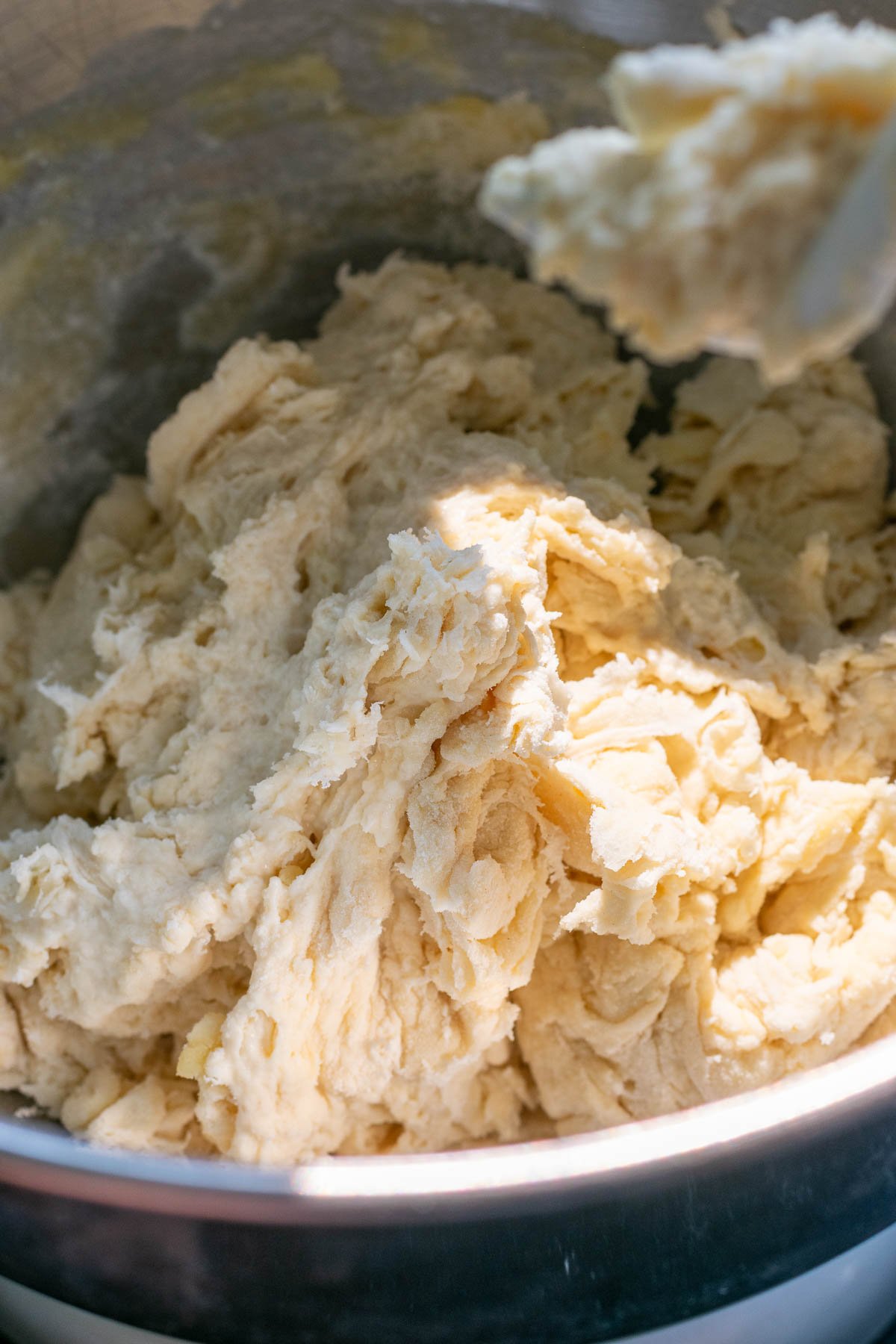 Start of mixing sourdough garlic knot dough in bowl of stand mixer.