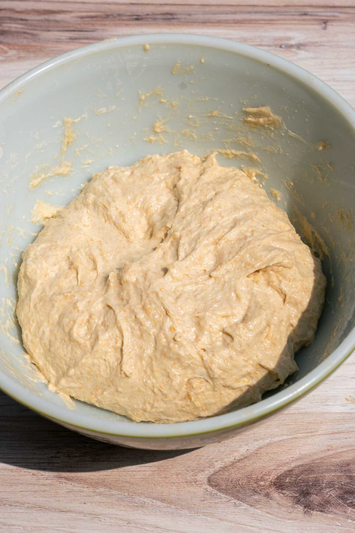 Mixed and shaggy einkorn sourdough bread dough in bowl at the end of mixing.