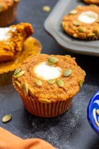 Sourdough pumpkin cream cheese muffins with pumpkin seeds on top