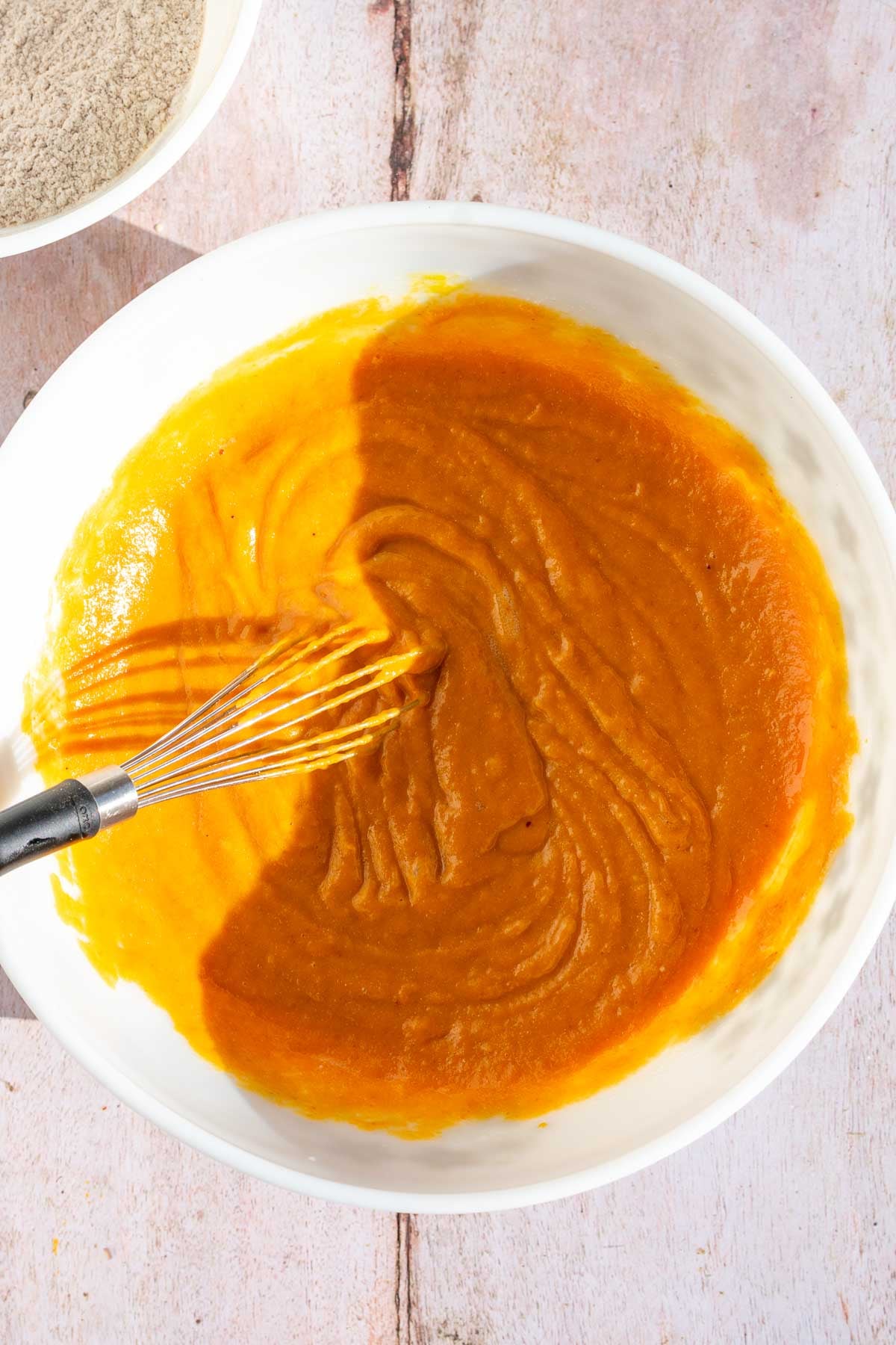 Whisked wet ingredients of sourdough pumpkin bread in a bowl