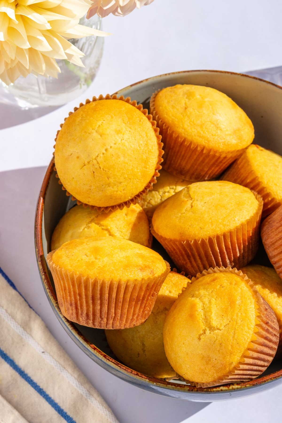 A bowl of sourdough corn muffins.