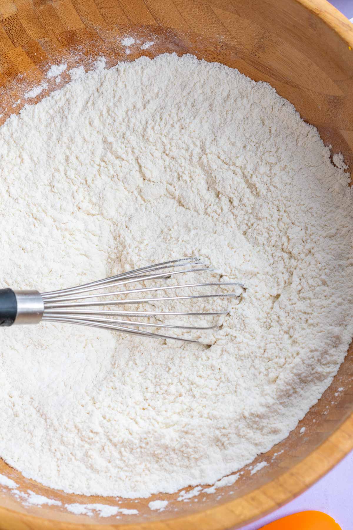Large bowl of mixed dry ingredients for sourdough sweet potato biscuits