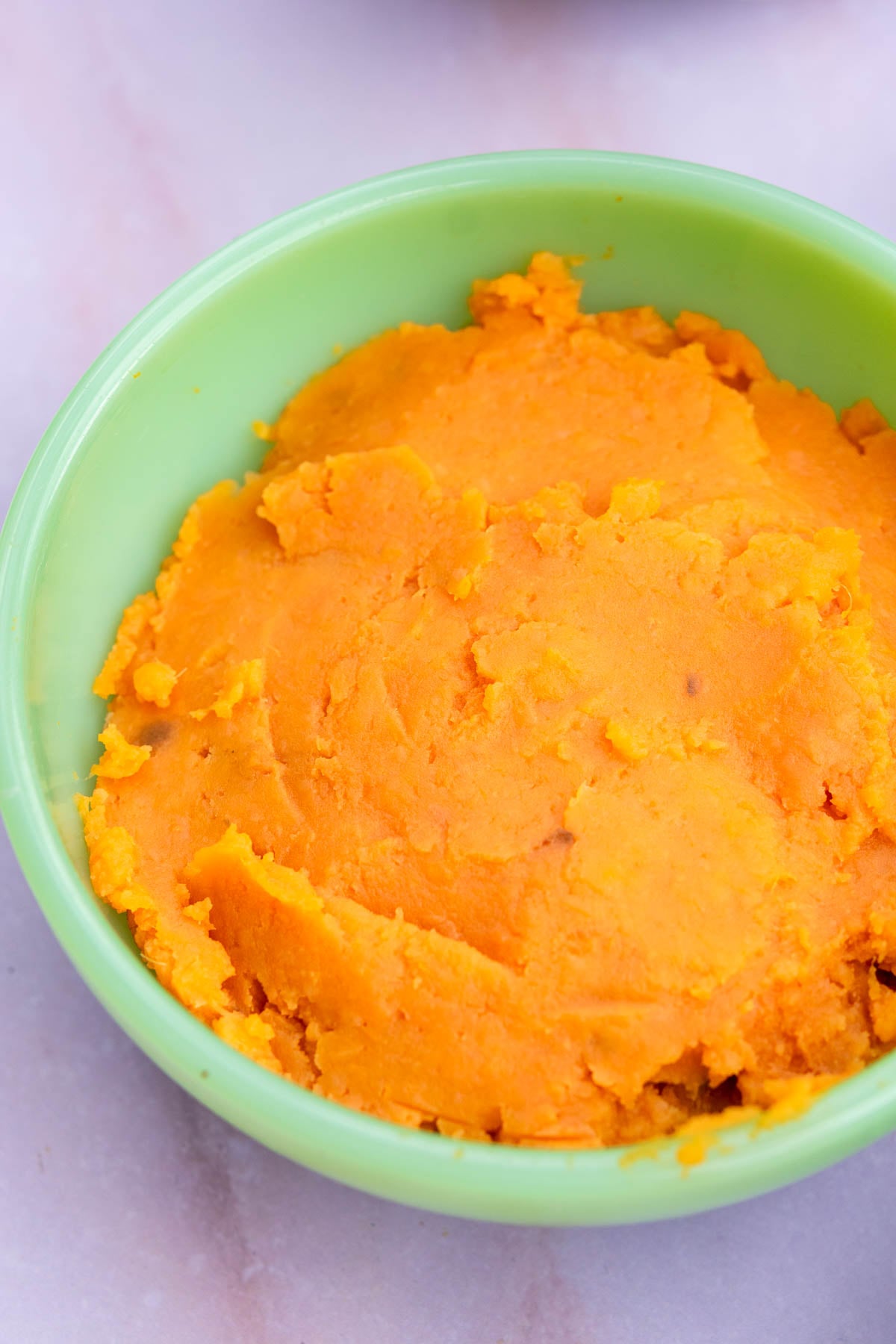 A bowl of mashed sweet potatoes.