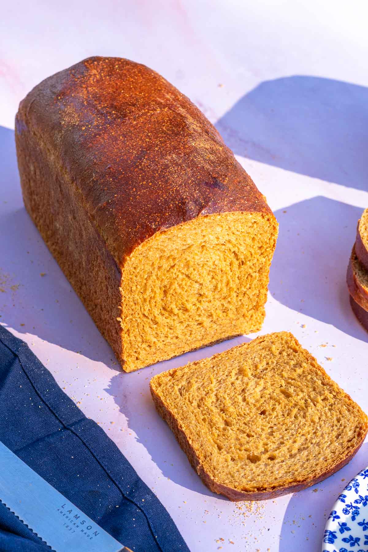 Loaf of sourdough anadama bread sliced.
