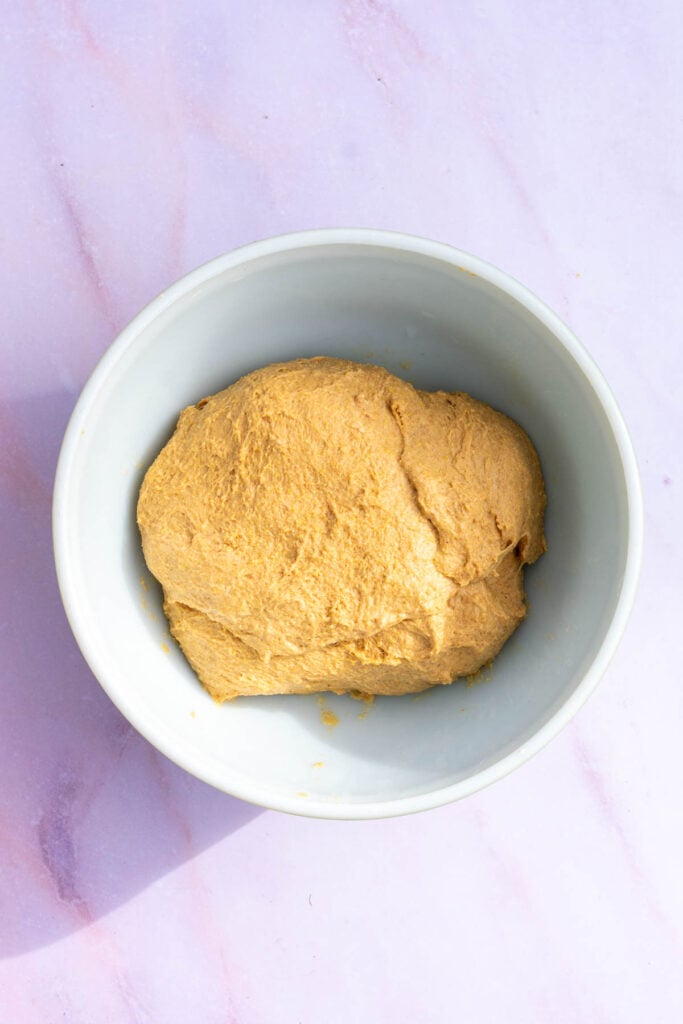 Sourdough anadama bread dough in bowl at the start of bulk fermentation.