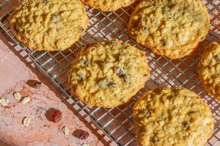 Brown butter sourdough oatmeal raisin cookies on a wire rack.