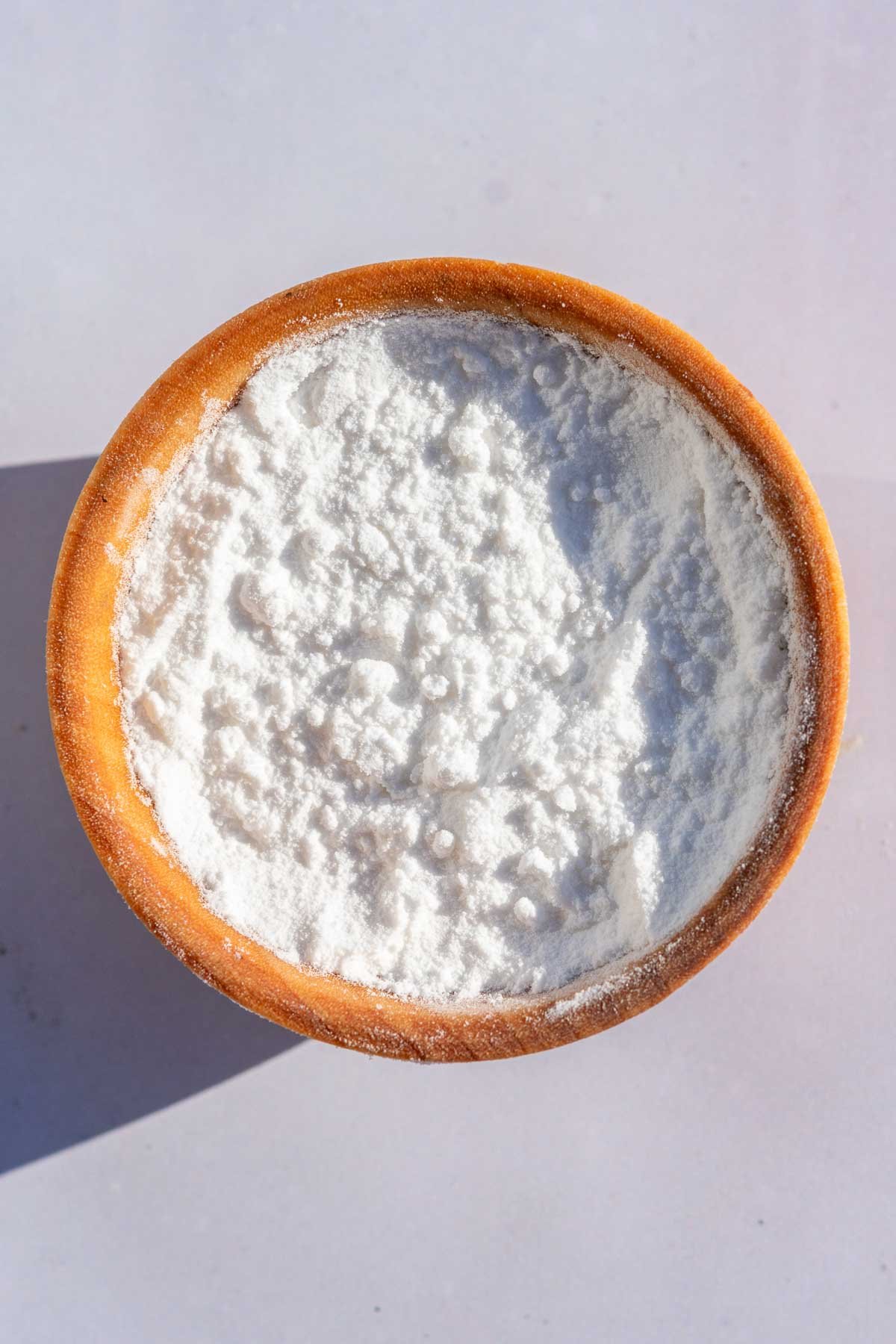 Close up of a small pinch bowl with cream of tartar.