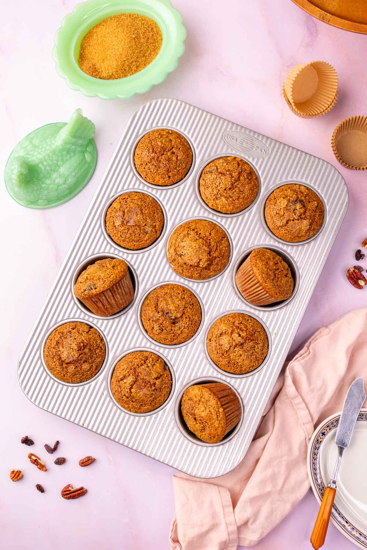 Baked muffin pan of sourdough bran muffins.