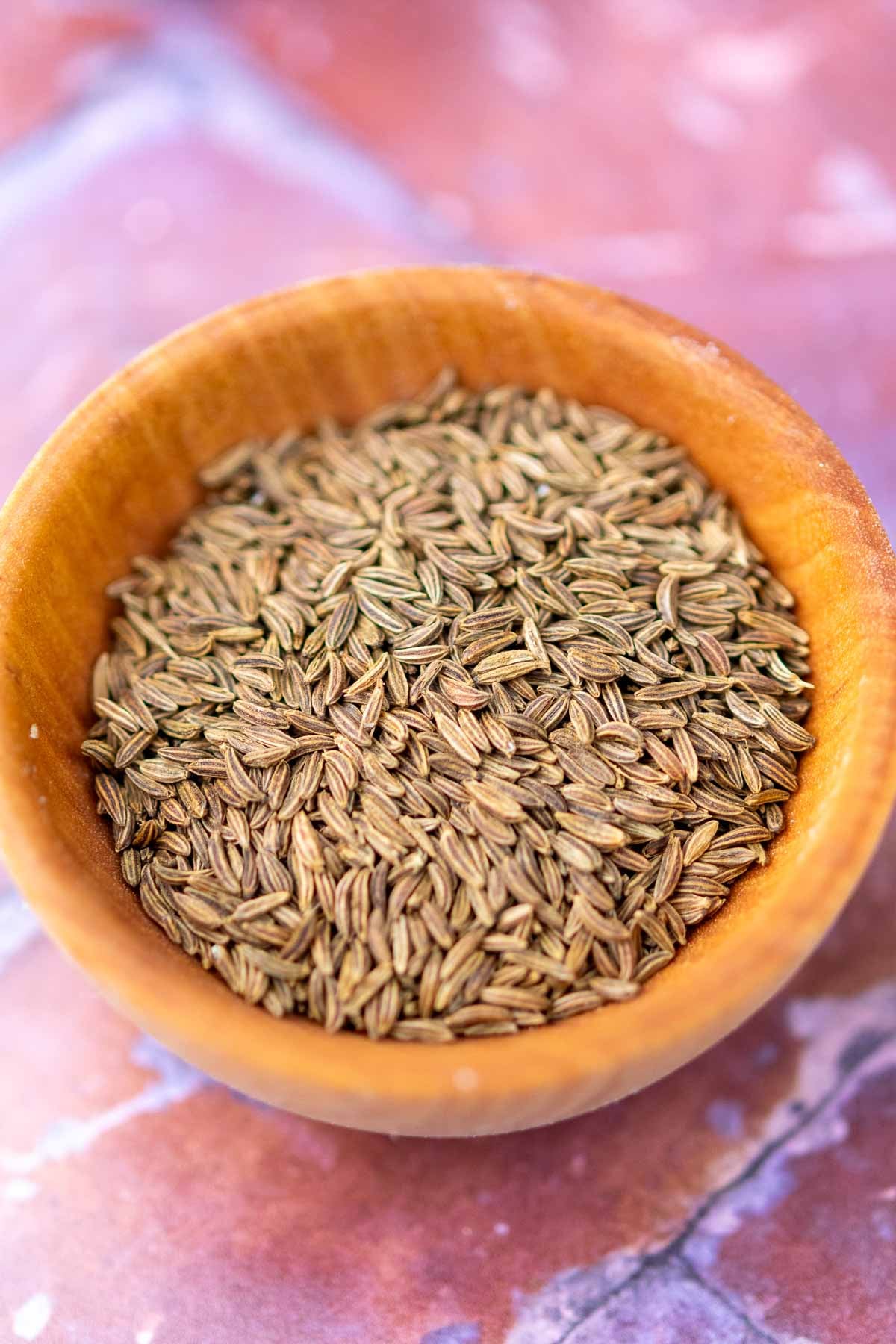 Small bowl of caraway seeds.