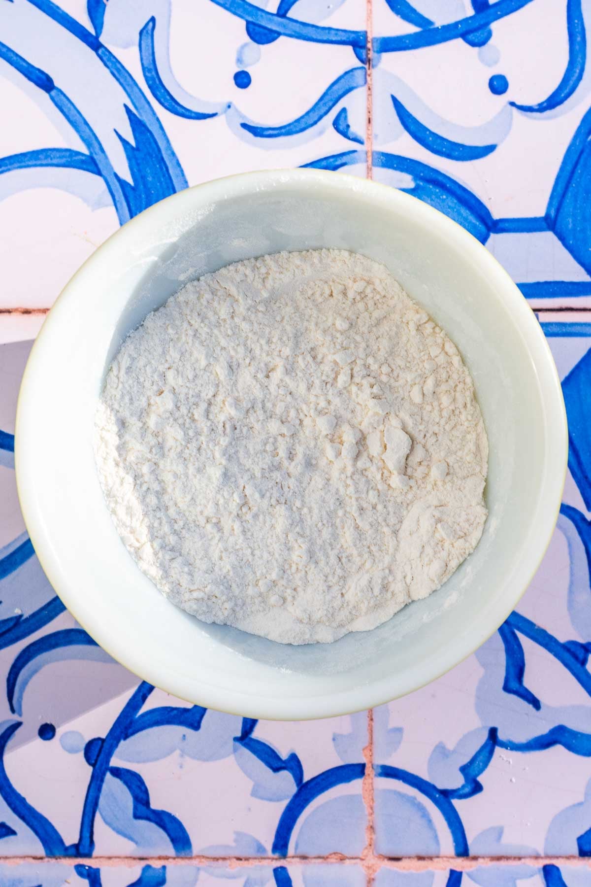 Bowl of mixed dry ingredients for sourdough tahini honey cookies.