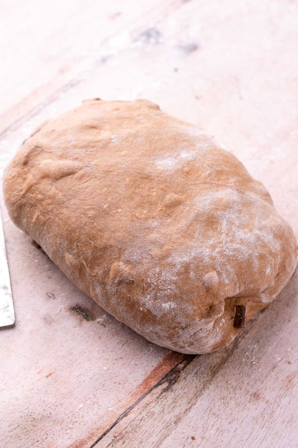 Shaped chocolate coffee sourdough bread on bench.