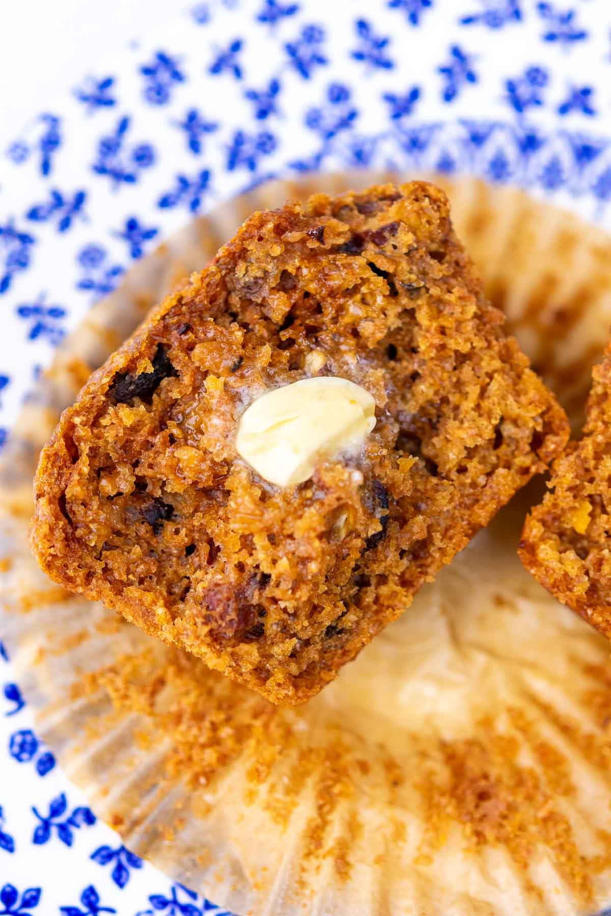 Half of a sourdough bran muffin with melting butter.
