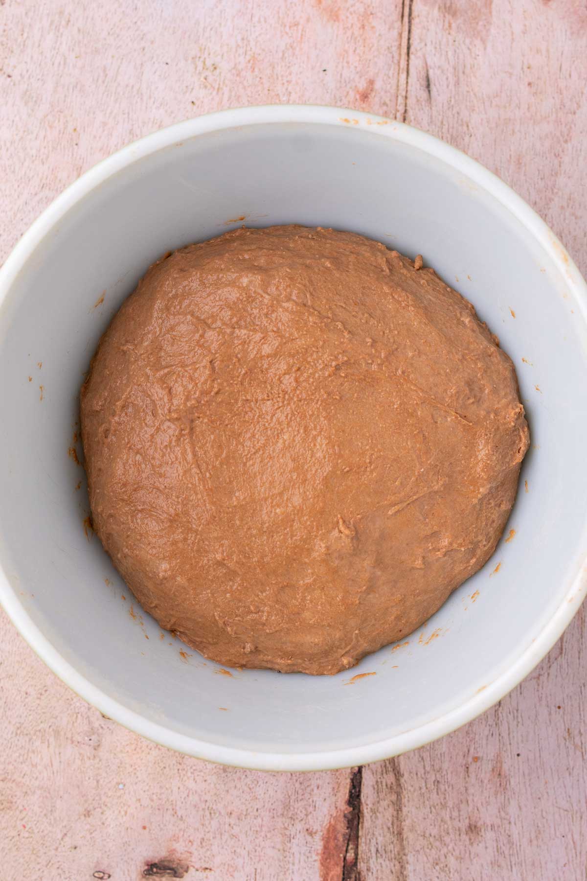 Chocolate coffee sourdough bread at the start of bulk fermentation in bowl.