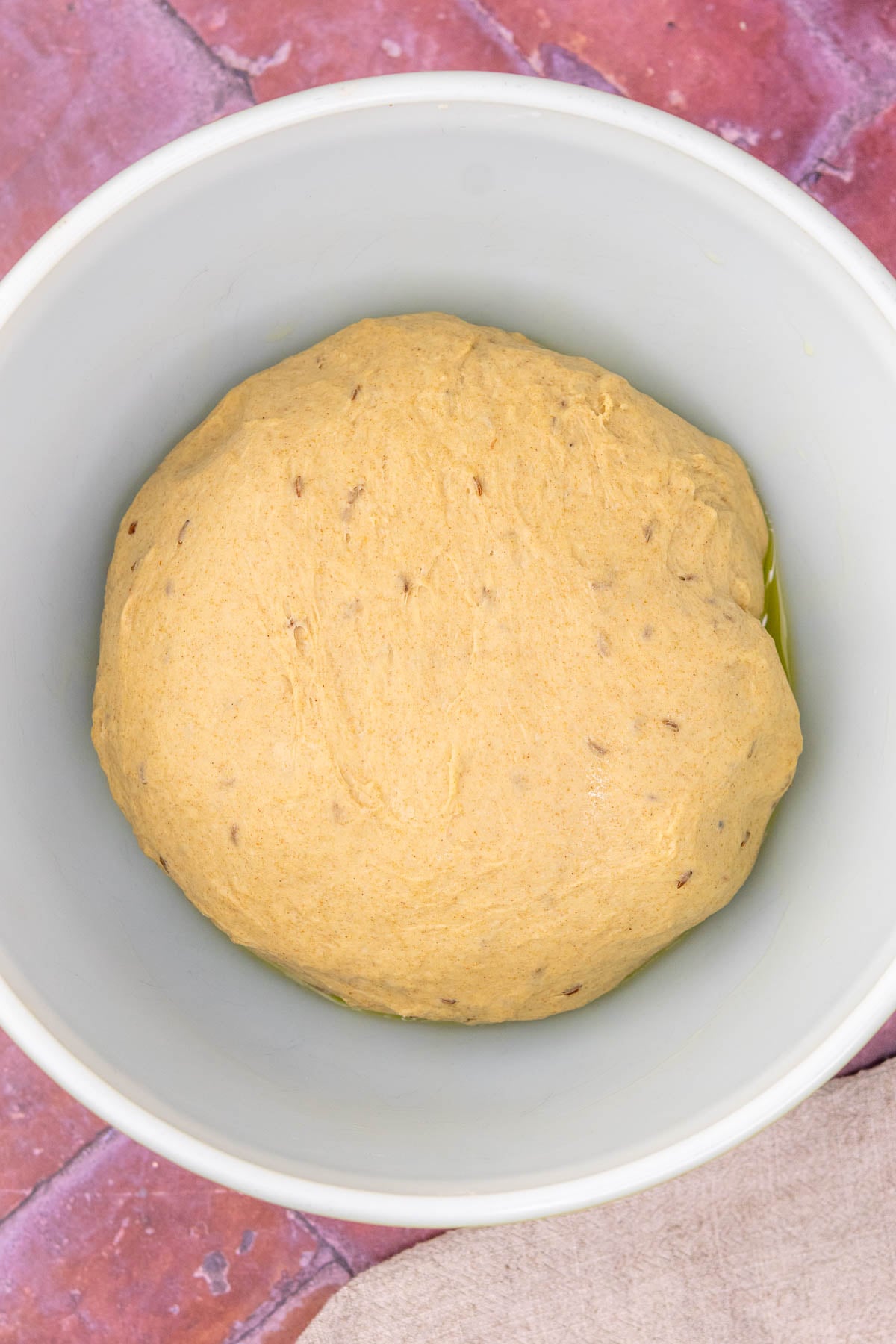 Sourdough rye sandwich bread dough in a bowl at the start of bulk fermentation.