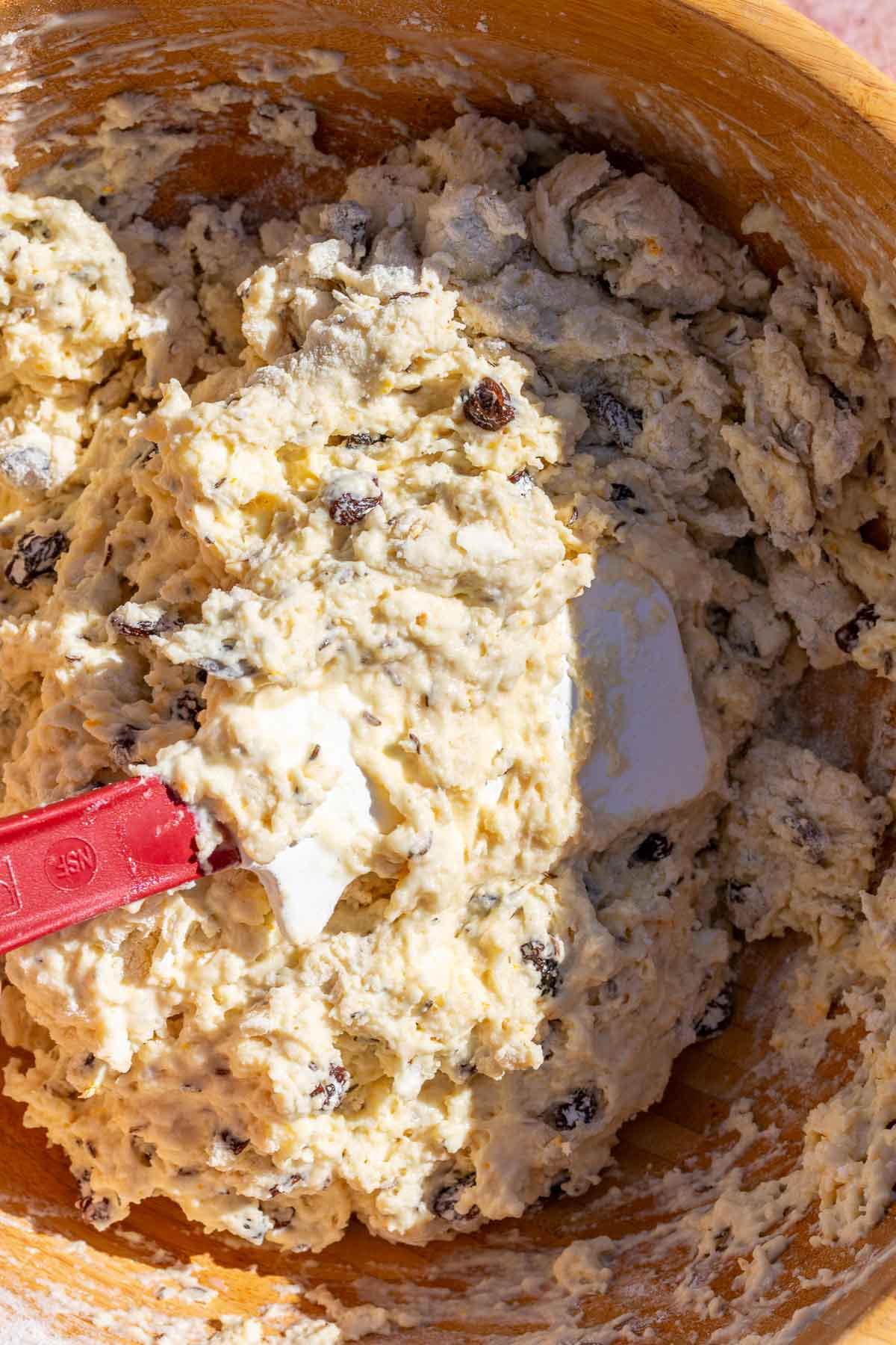 Mixing Sourdough Irish soda bread dough with a spatula.