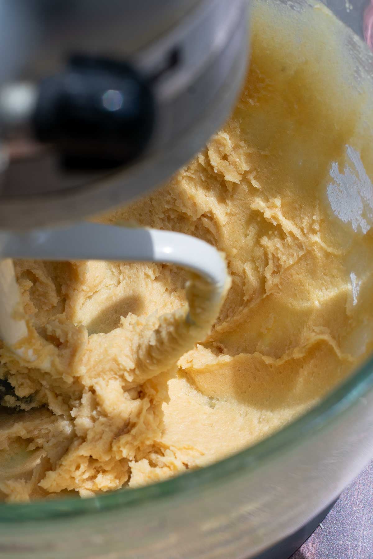 Butter, brown sugar, and honey combined in the bowl of a stand mixer with the paddle attachment.