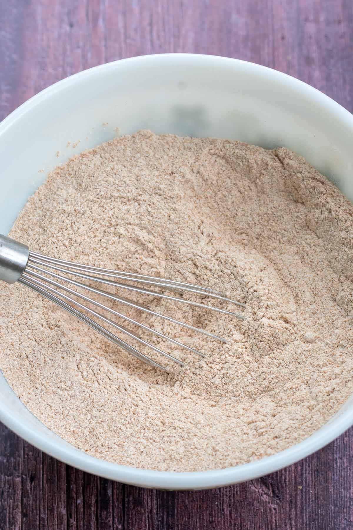 Bowl of mixed dry ingredients for sourdough graham crackers.