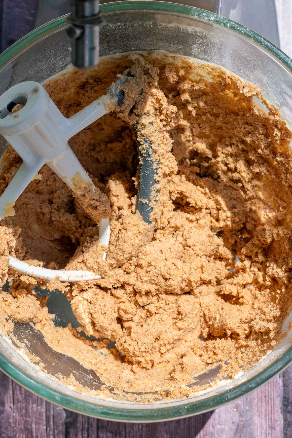 Mixed sourdough graham cracker batter in the bowl of a stand mixer.