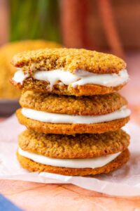 Stack of three sourdough oatmeal cream pies with bite taken out of the top one.