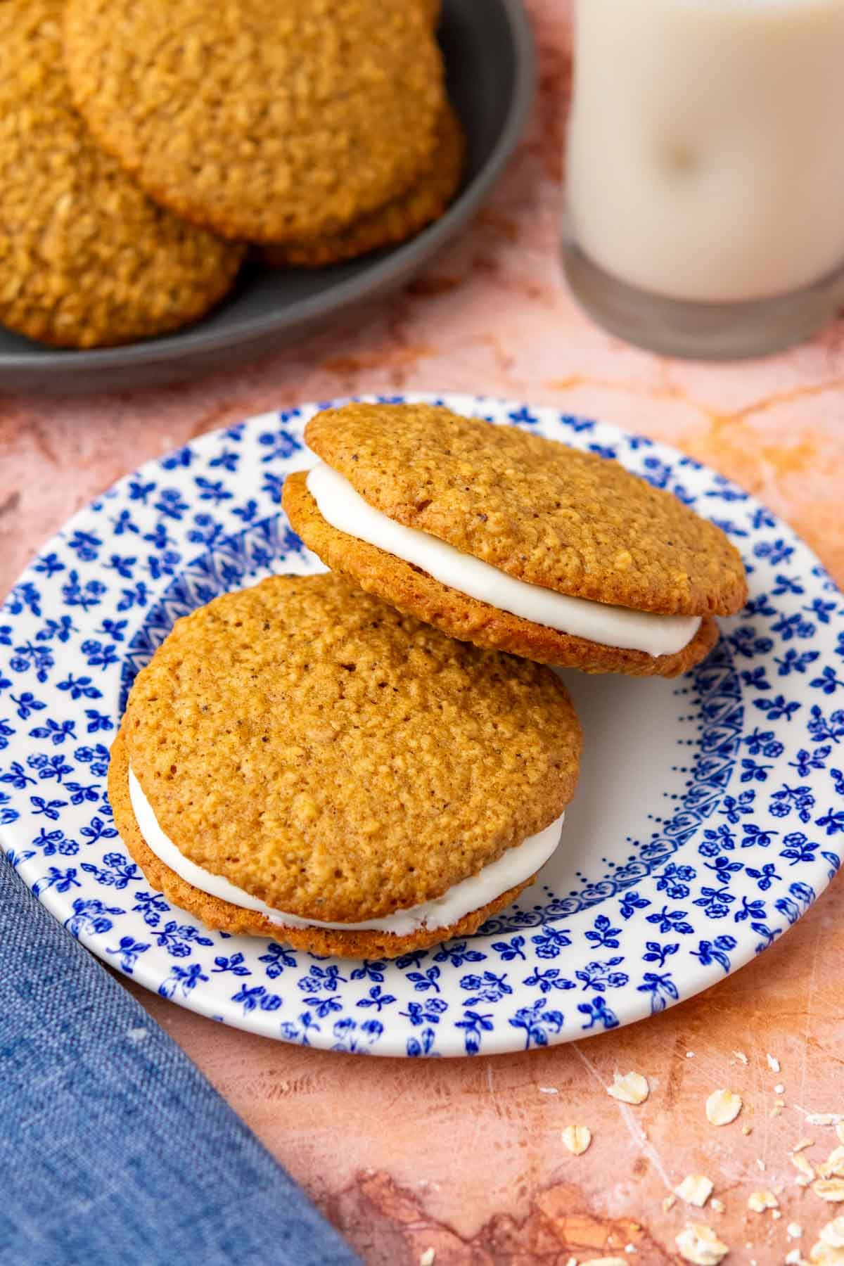 Two sourdough oatmeal cream pies on a plate.