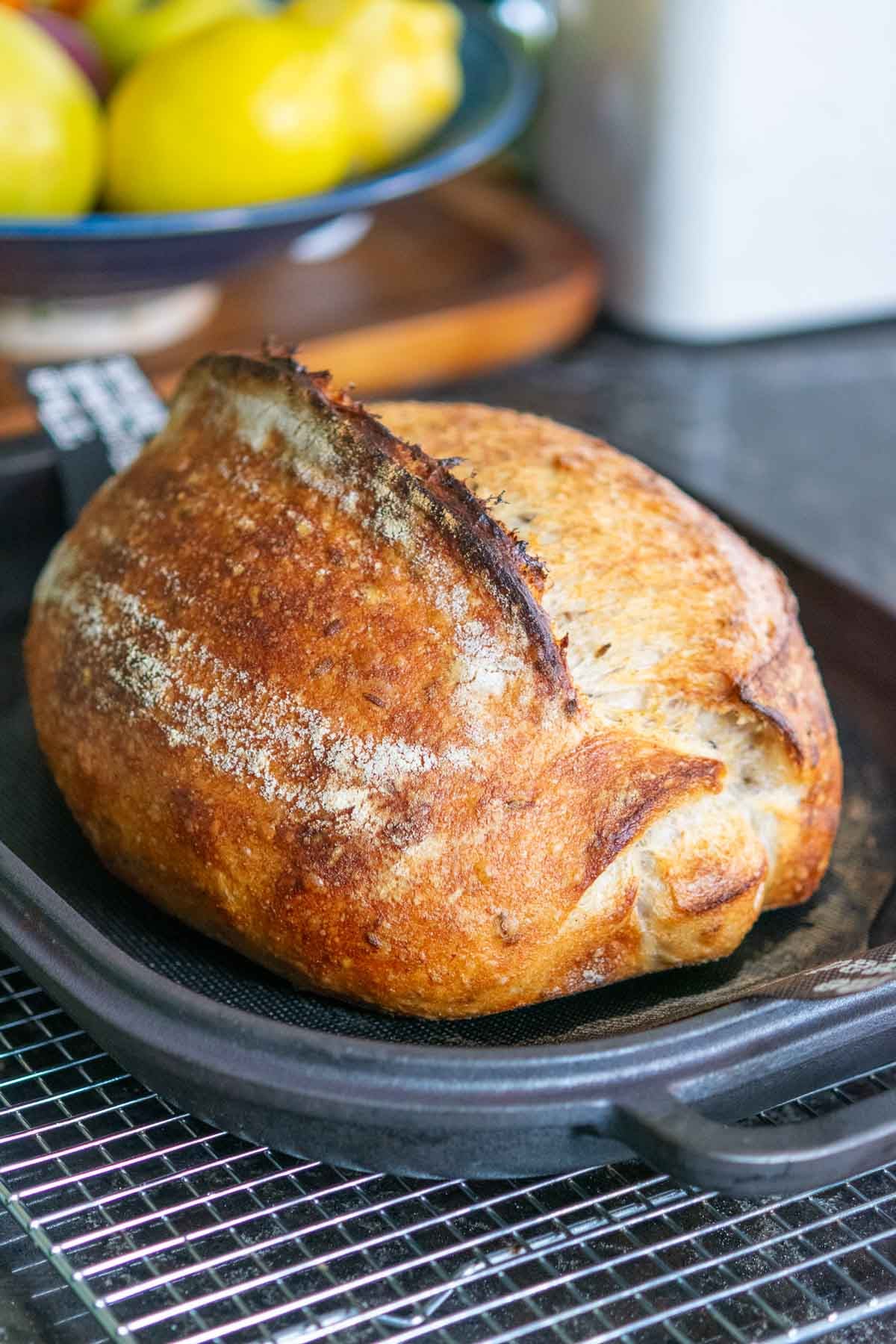 Baked lavender vanilla sourdough bread in pan.