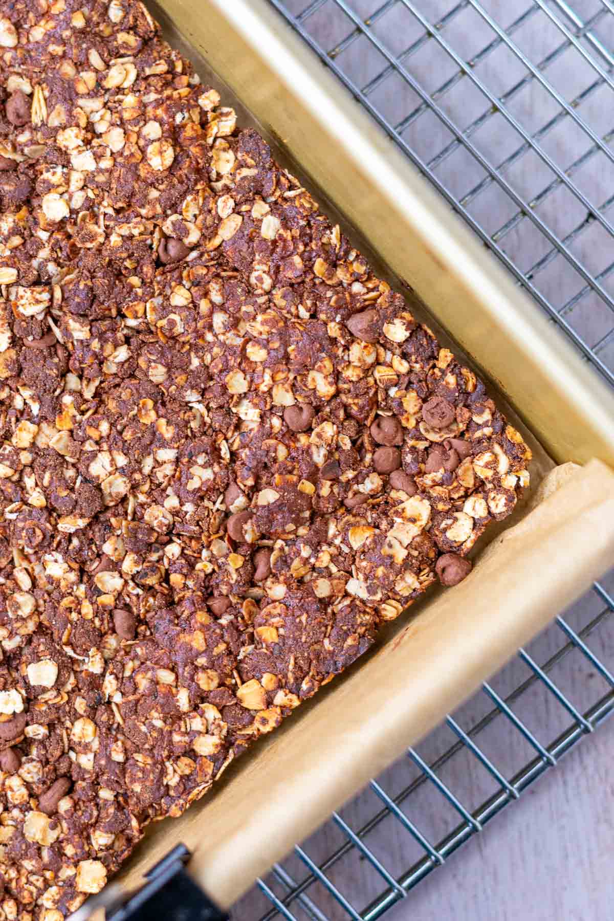 Baked sourdough chocolate protein granola bars in pan.