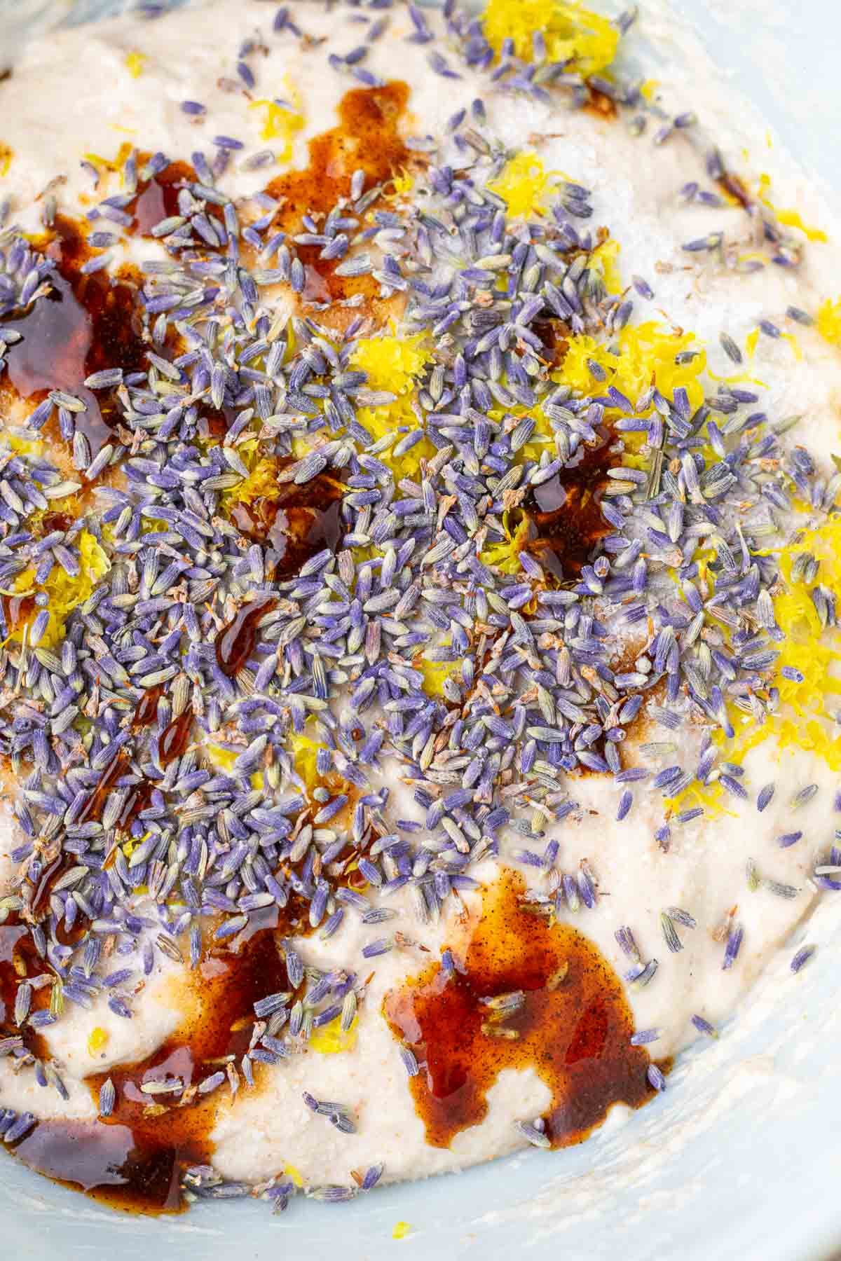 Dried lavender, lemon zest, salt, and vanilla paste on top of dough before mixing.