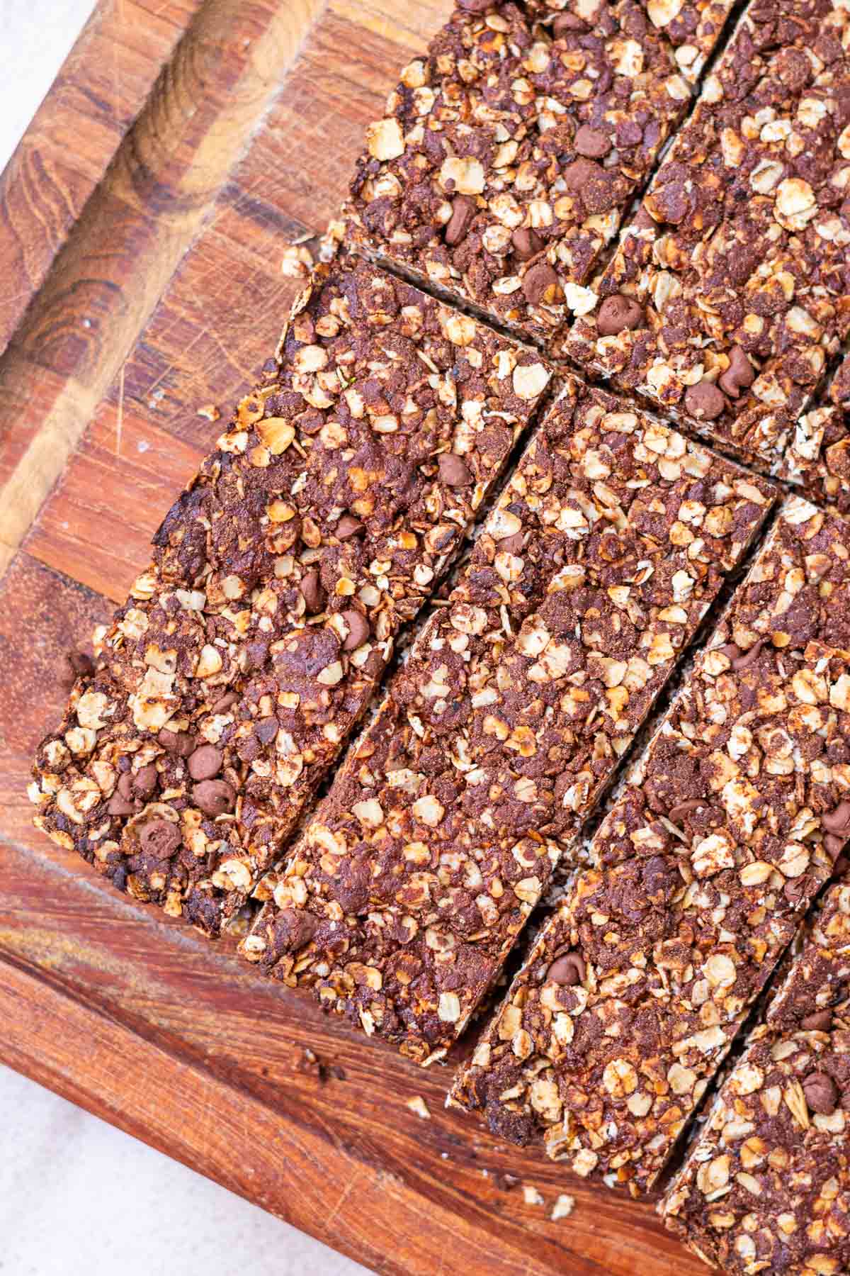 Sliced sourdough chocolate protein granola bars on a cutting board.