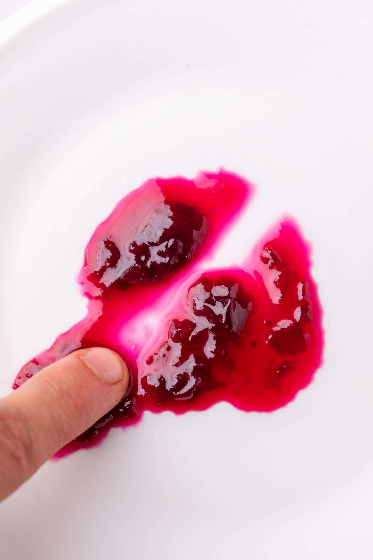 Freezer plate test- finger scraping a line through jam and it not setting.