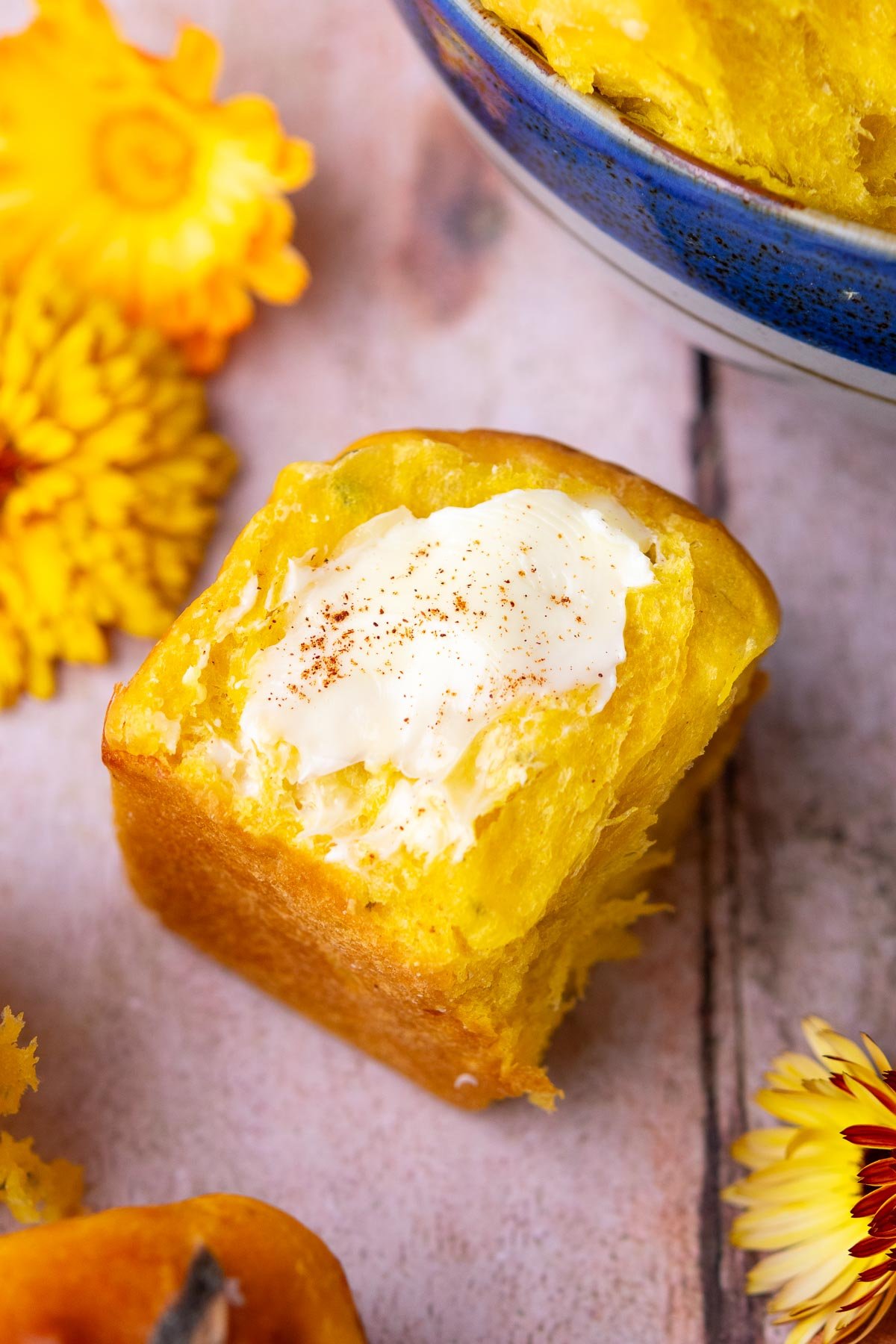 Cinnamon butter on a sourdough sweet potato dinner roll.