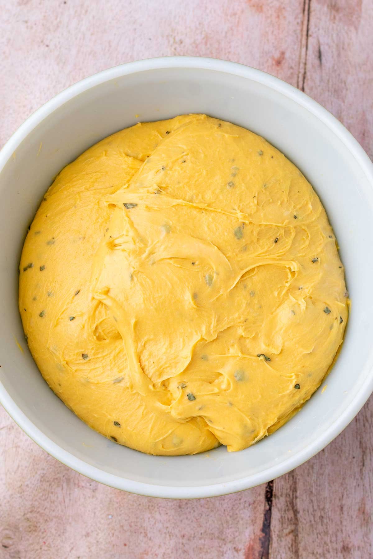 Sourdough sweet potato dinner roll dough doubled in size in bowl at the end of bulk fermentation